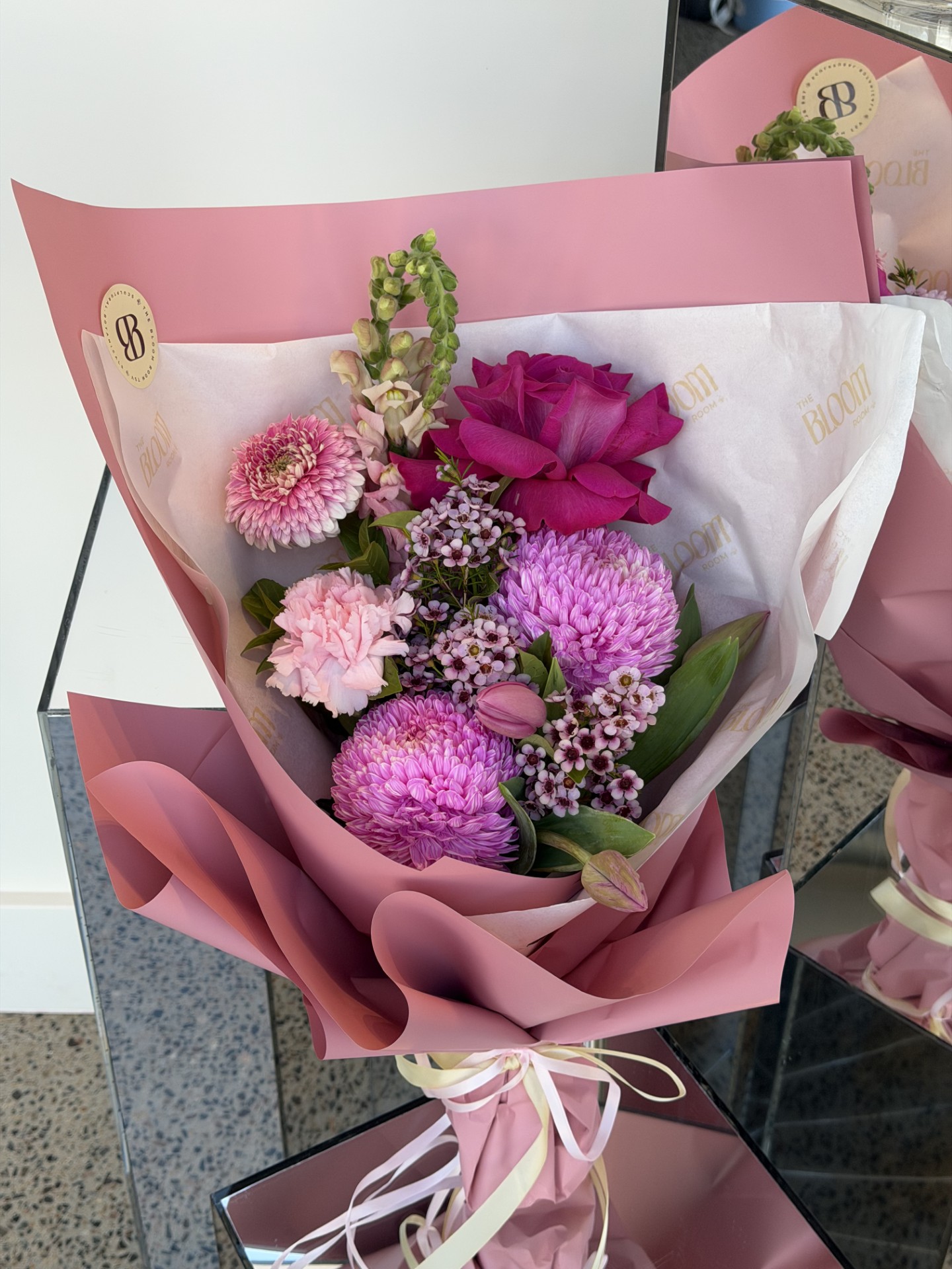 Pink Blooms bouquet wrapped in blush pink paper